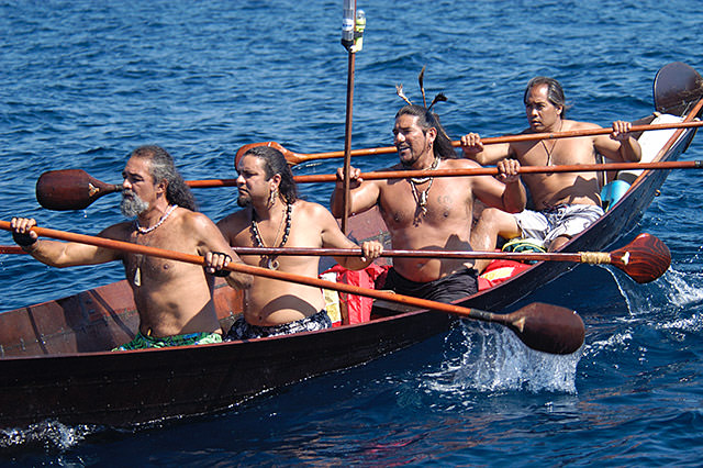 people rowing in a tomol