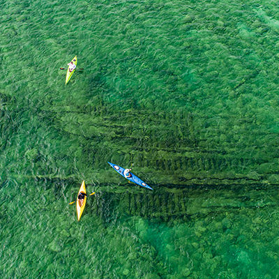 kayakers above a shipwreck