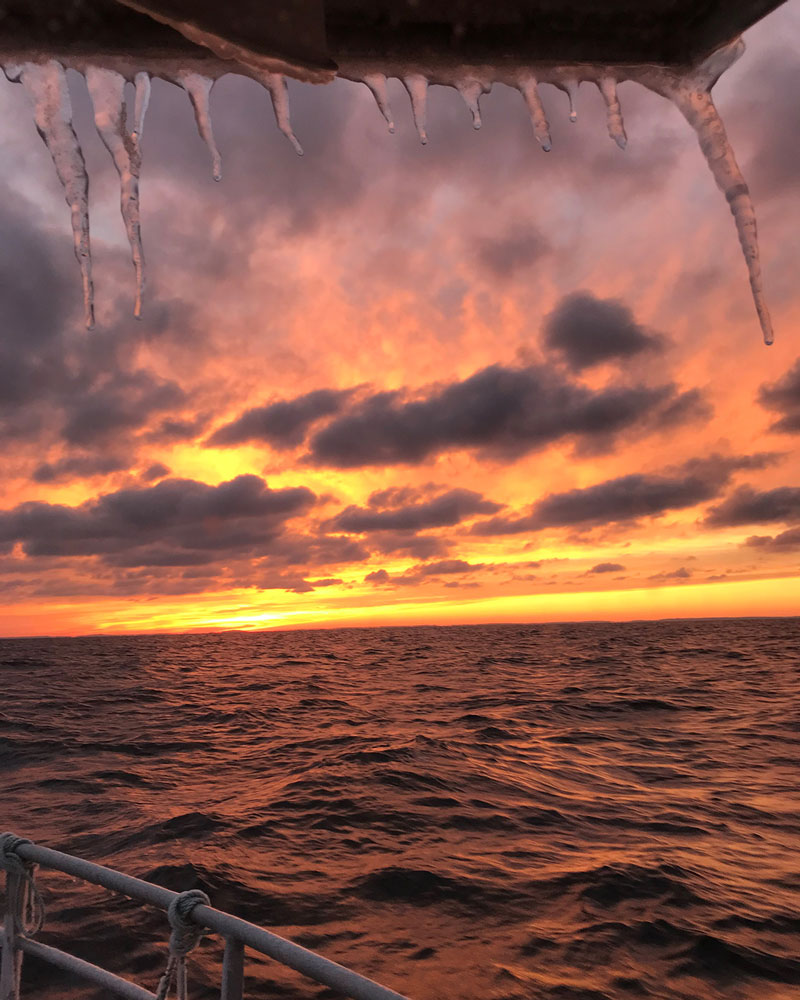 sunset off boat with icicles
