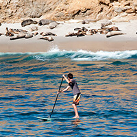 a person paddleboarding
