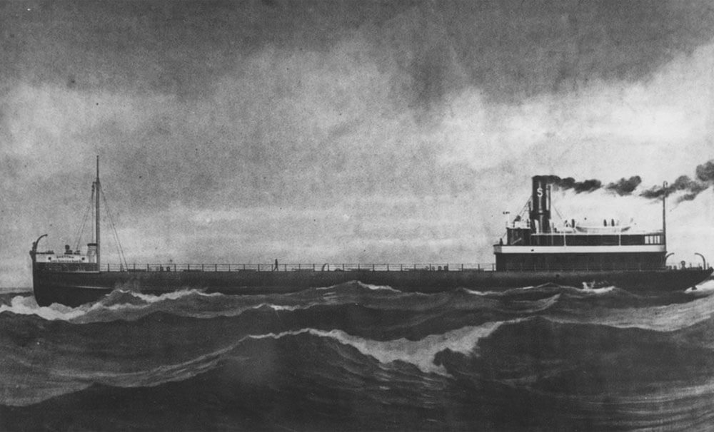 a black and white photo of a vessel on the water with a steame stack