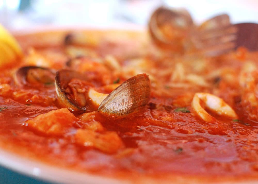 a red sauce with clams and other seafood
