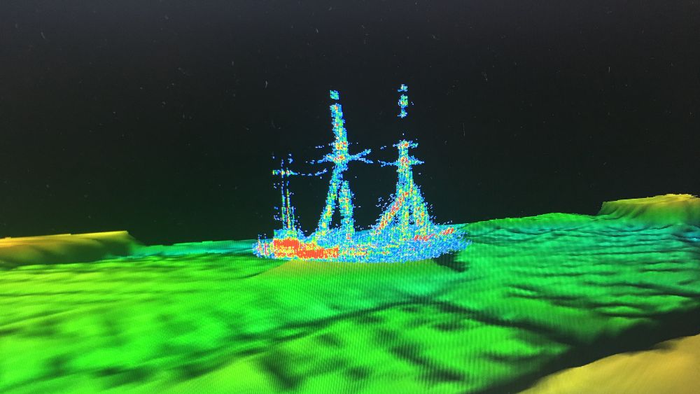 a multi-colored image of a sailboat with three masts