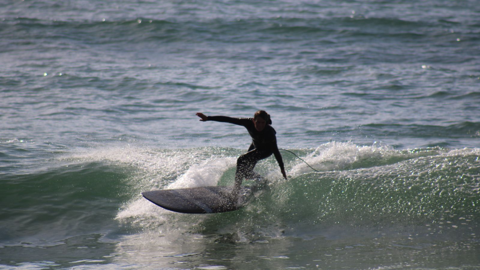 Kyla Langen enjoying the power of the ocean from her surfboard.