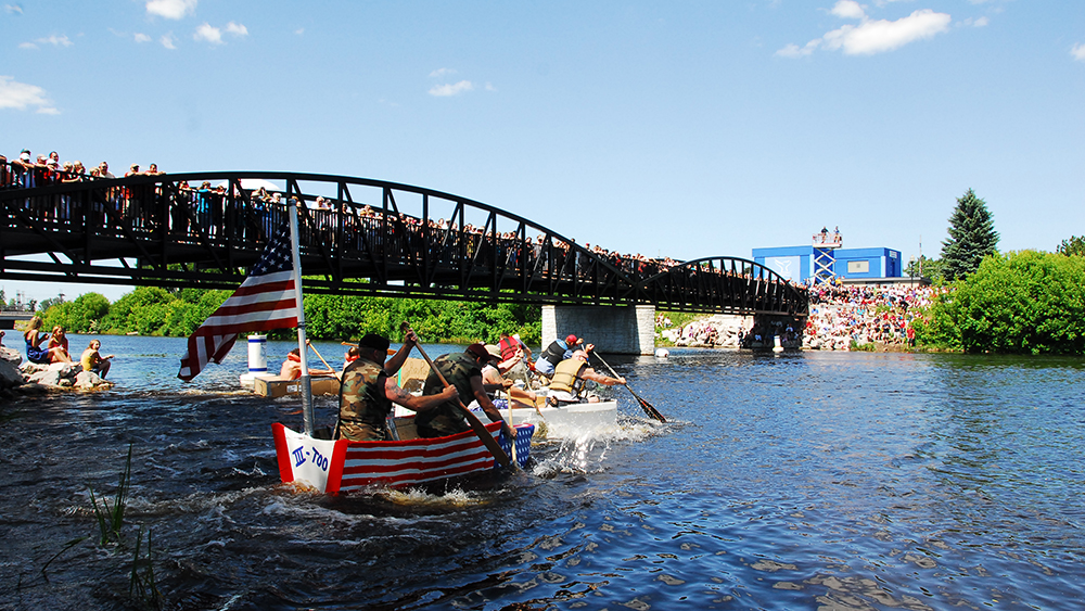 Rowing boat under a bridge